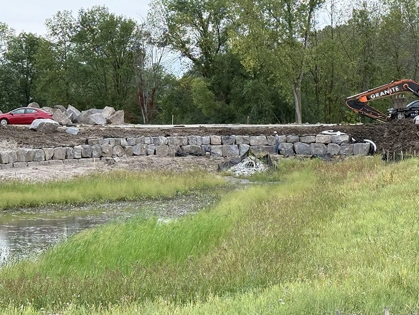 Commercial Granite Retaining Wall Along A Pond Under Constru | Granite Companies MN