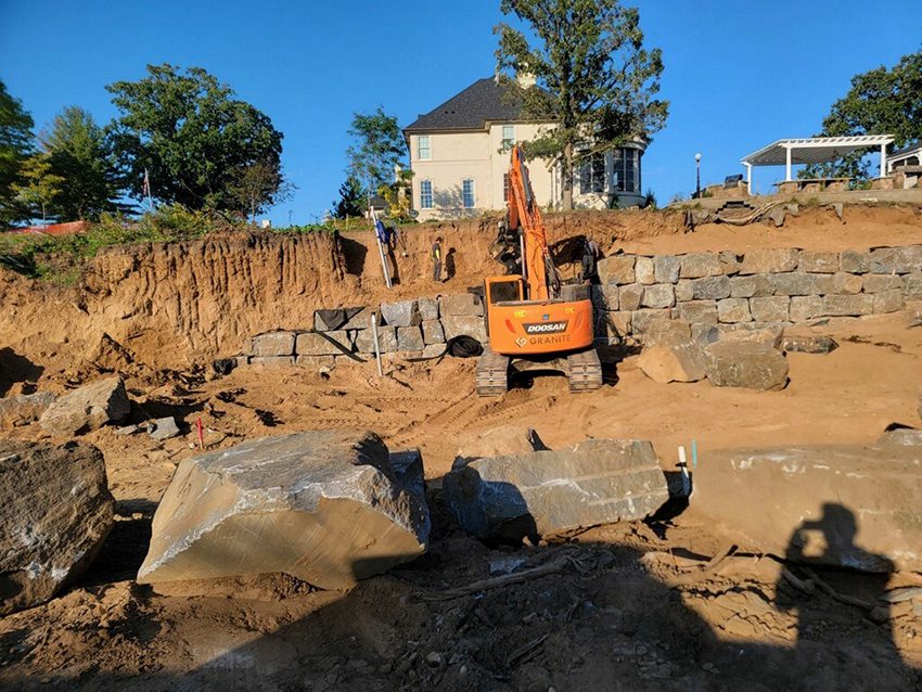 Equipment Escavator With Rotator Working On Granite Wall 01 | Granite Companies MN
