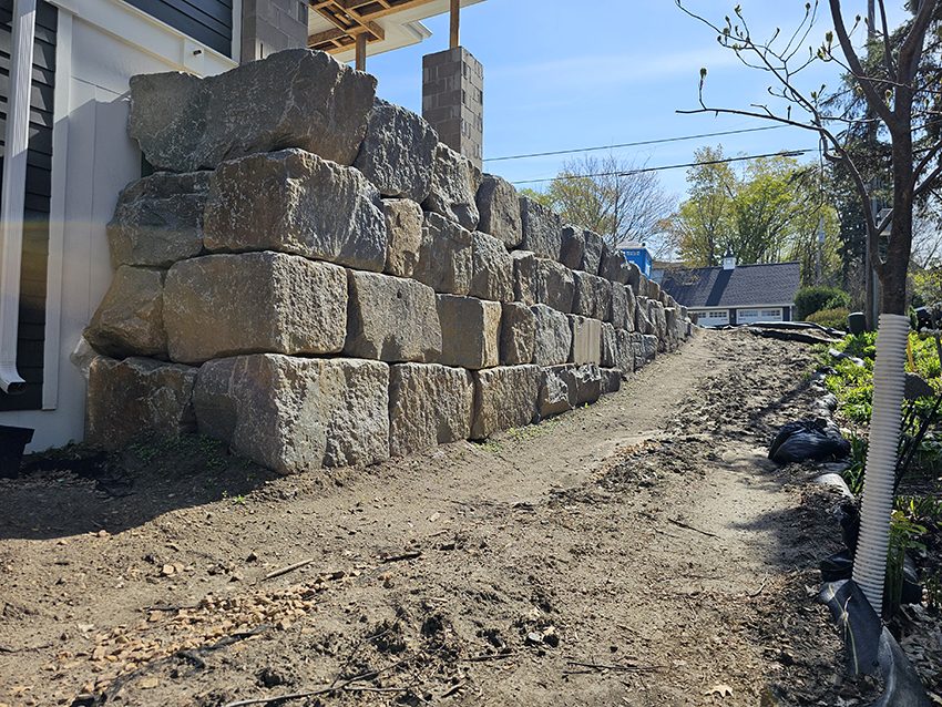 Residential Granite Boulder Retaining Wall Under Constructio | Granite Companies MN