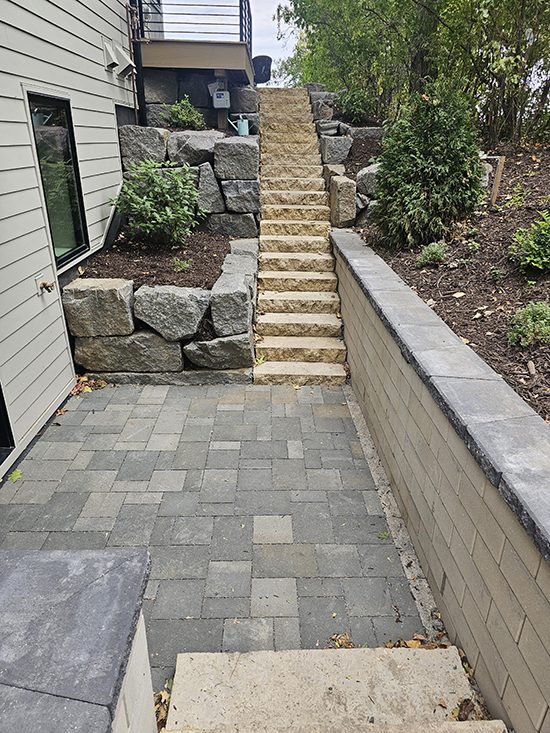 Residential Resiential Natural Granite Steps Beside A Paver Patio And Bo | Granite Companies MN