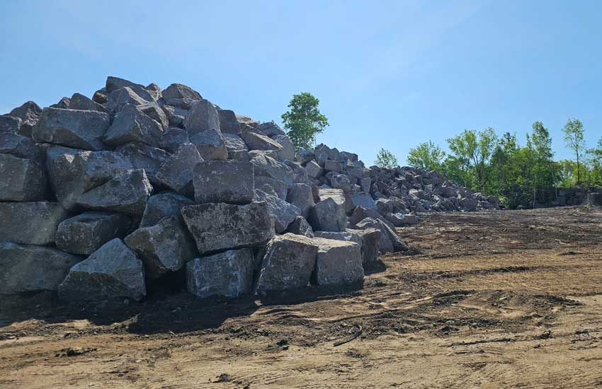 Granite Companies quarry — granite boulders stockpiled at yard MN